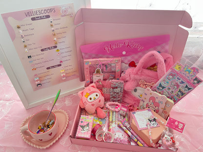 Pink stationery set with Hello Kitty theme on a pink surface